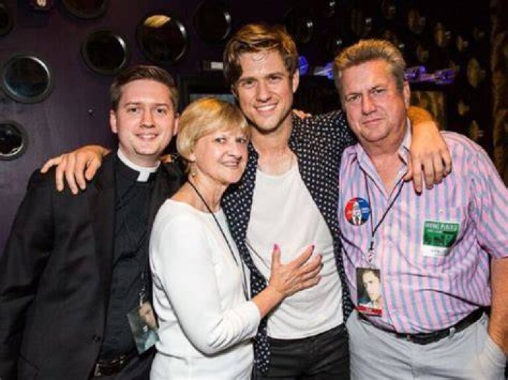 Aaron Tveit and his family members