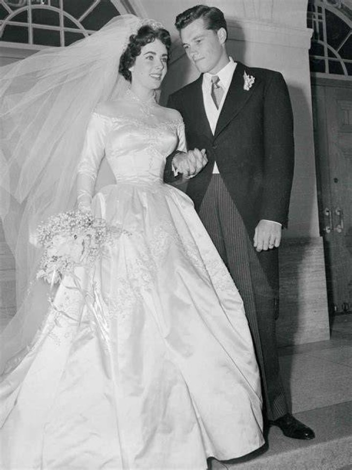 All 8 of Elizabeth Taylor’s Iconic Wedding Dresses (In Order)