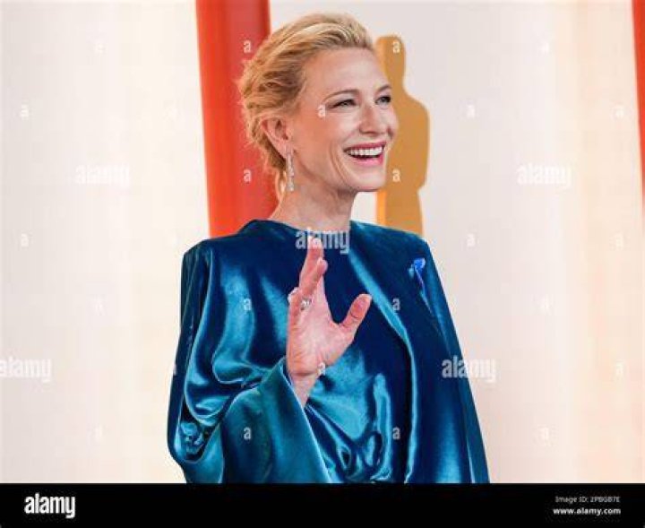 Cate Blanchett walking while holding hands with her eldest son Dashiell John Upton.