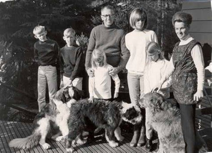 Charles Schulz, his family, and Spike the dog posing for a photo