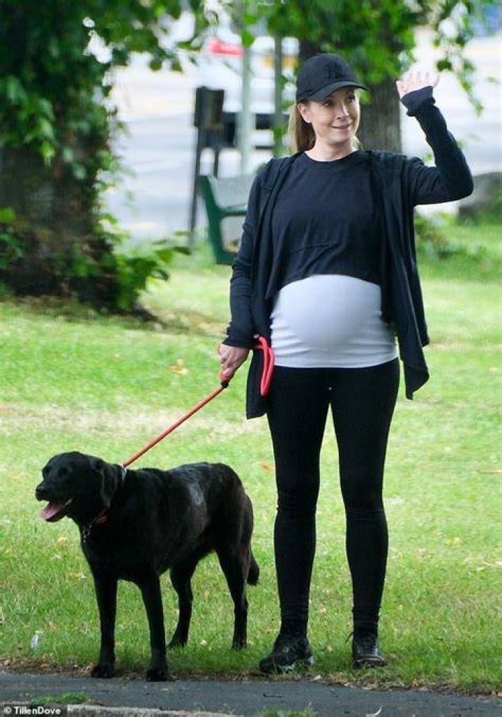 Joanne photographs with her pregnant belly on Sunday during a shopping outing in New York City