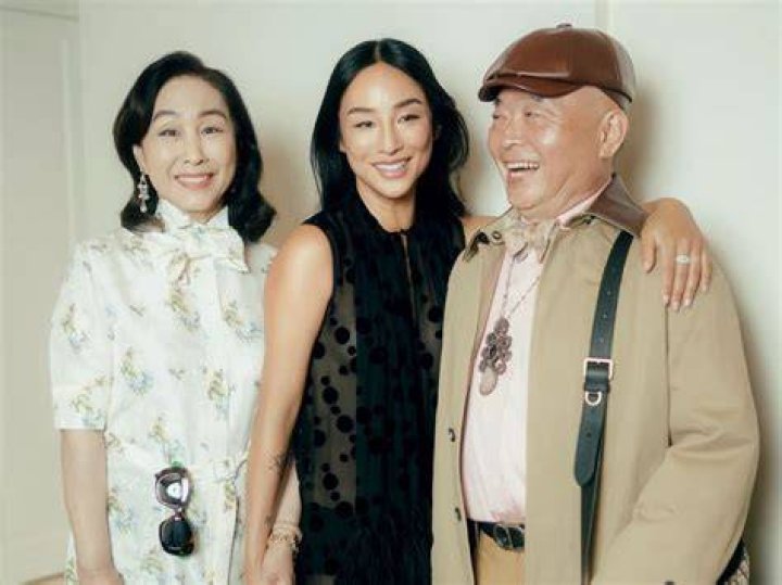 Lee with her parents and grandmother.