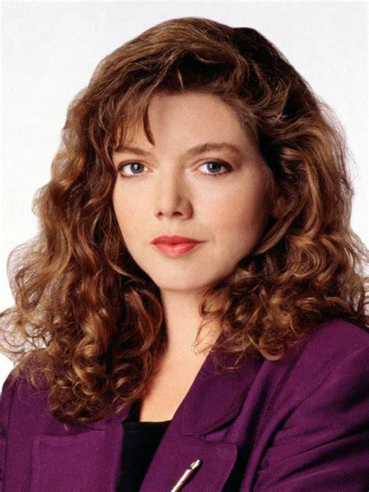 Pictures of Catherine Disher posing for her photoshoot wearing blue color gown