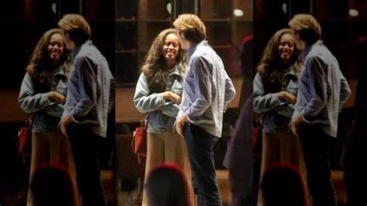 Rory and Malia Kissing at the rugby match which was spotted by The Paparazzi