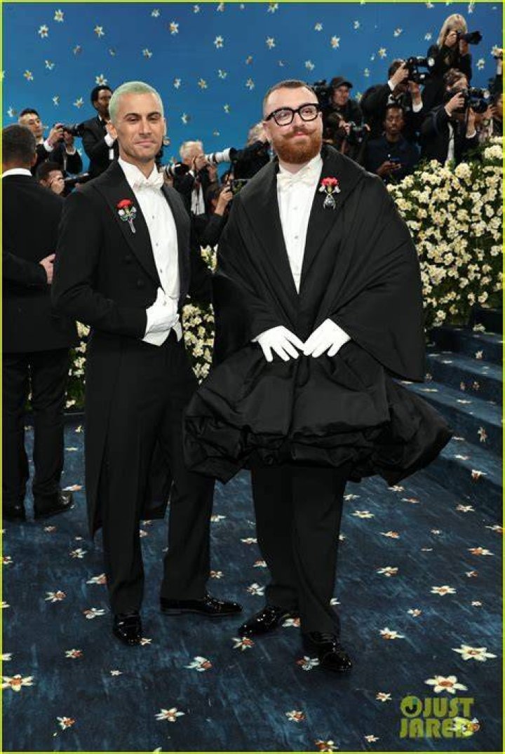 Sam Smith giving Christian Cowan a kiss